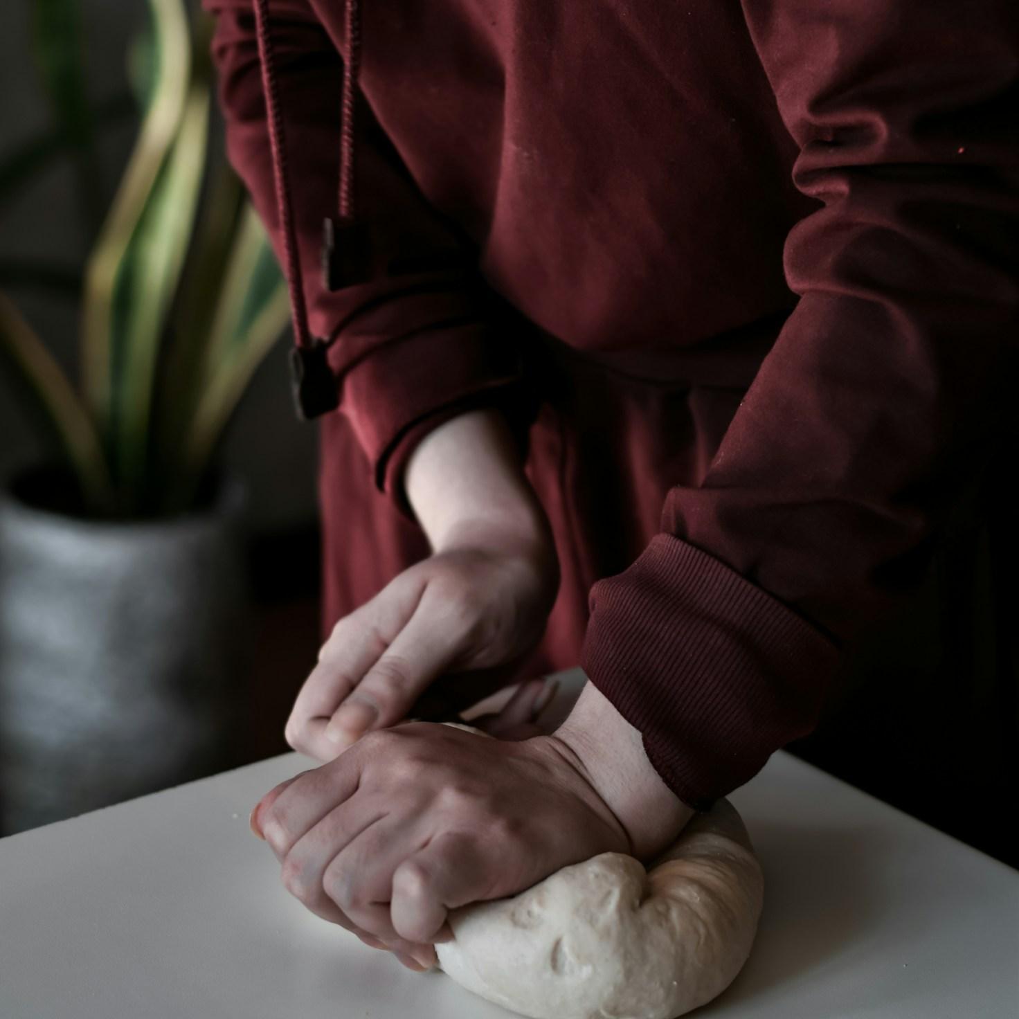 Community members collaborating in a modern kitchen space, sharing recipes and cooking techniques